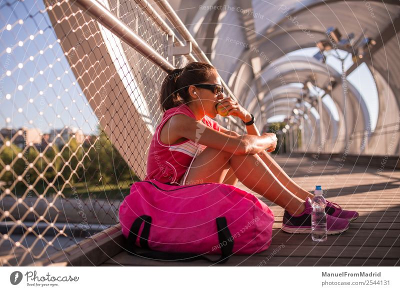 young woman runner eating an apple Fruit Apple Nutrition Eating Lifestyle Happy Beautiful Body Wellness Summer Sports Jogging Human being Woman Adults Fitness