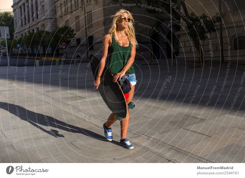 woman skater walking down the street Lifestyle Style Joy Beautiful Summer Woman Adults Street Fashion Sunglasses Blonde Smiling Carrying Cool (slang)