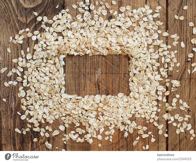 Rolled oats top view Nutrition Breakfast Vegetarian diet Diet Summer Nature Wood Natural background Cereal Cooking flakes food grain health healthy Ingredients
