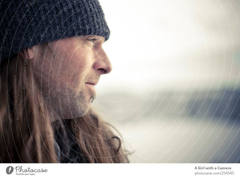 love him Human being Masculine Man Adults Life Head 1 30 - 45 years Cap Long-haired Designer stubble Looking Dream Dreamily Sadness Winter Exterior shot