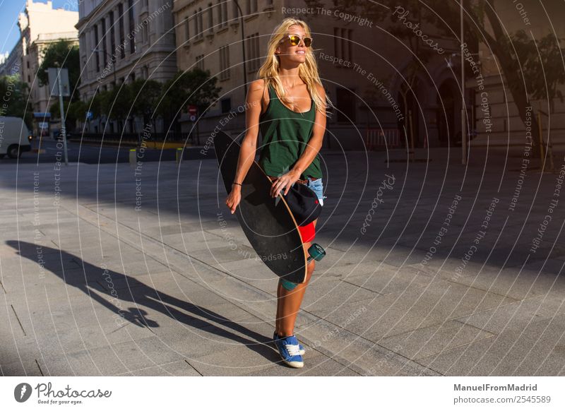 young woman skating in the street Lifestyle Style Joy Beautiful Summer Woman Adults Downtown Street Sunglasses Blonde Cool (slang) Eroticism Hip & trendy casual