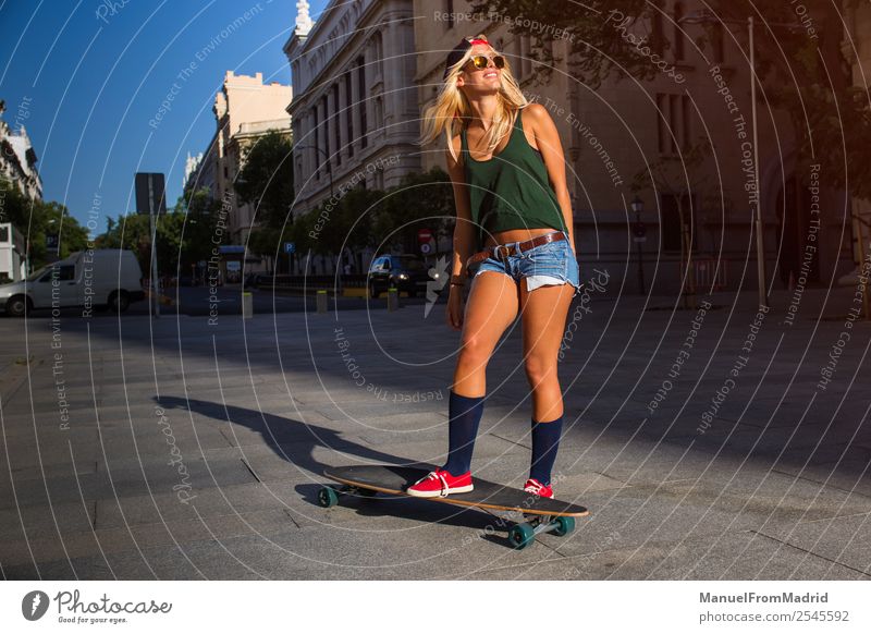 young woman skating in the street Lifestyle Style Joy Beautiful Leisure and hobbies Summer Woman Adults Downtown Street Sunglasses Blonde Smiling Cool (slang)