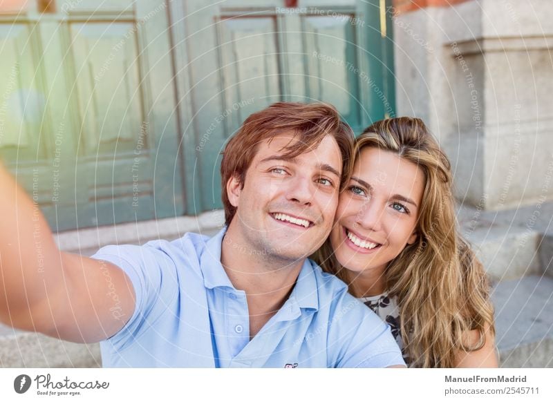 young couple taking a selfie Lifestyle Joy Happy Beautiful Leisure and hobbies Vacation & Travel Summer Telephone Camera Woman Adults Man Couple Smiling Love