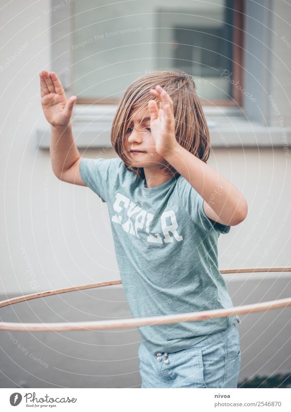 Boy with long hair makes Hulahoop Life Summer Sports Hula hoop Schoolchild Human being Masculine Boy (child) 1 8 - 13 years Child Infancy Beautiful weather Town