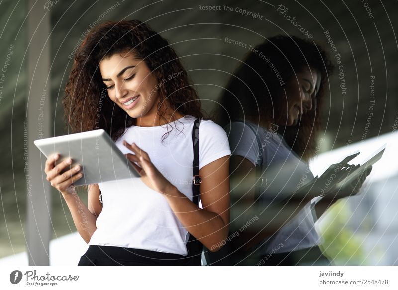 Young African woman with looking at her digital tablet Lifestyle Style Happy Beautiful Hair and hairstyles Tourism Technology Internet Human being Woman Adults
