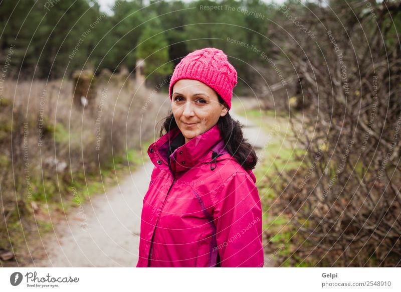 Matured woman Lifestyle Beautiful Freedom Winter Hiking Human being Woman Adults Nature Autumn Tree Leaf Park Forest Lanes & trails Fashion Hat Brunette Long