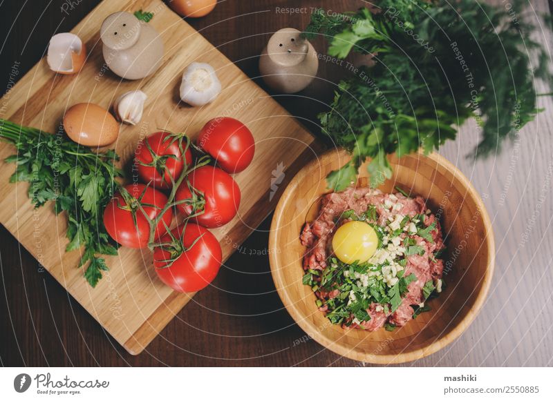 Raw minced meat with egg, herbs and fresh tomatoes Meat Vegetable Nutrition Plate Bowl Kitchen Fresh Beef ball loaf prepare Hamburger Garlic Heap pepper