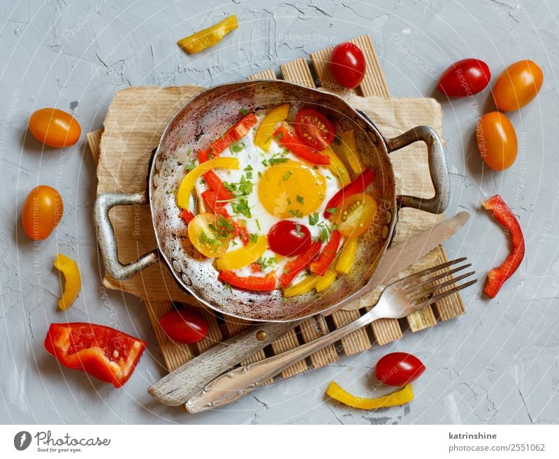 Fried egg with a bell pepper and tomatoes Vegetable Breakfast Pan Table Fresh Bright Yellow Red Cholesterol Cooking fat food Frying Fried egg sunny-side up Meal
