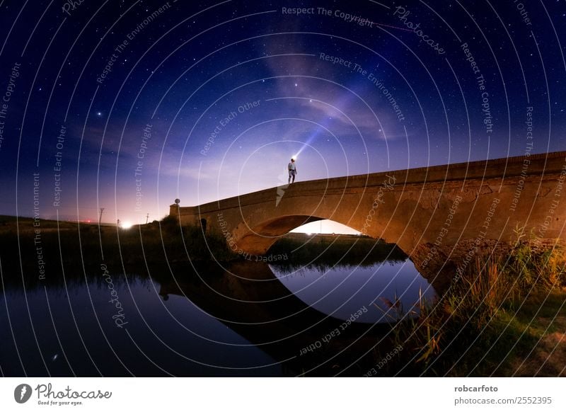 Man crossing bridge in the countryside at night Design Vacation & Travel Woman Adults Sky Town Bridge Building Architecture Transport Street Overpass Line