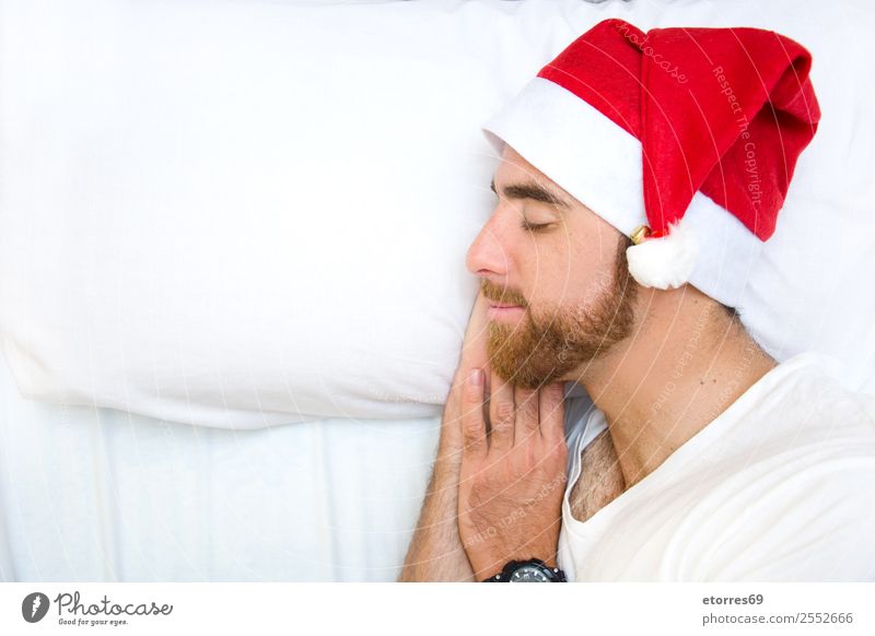 Man with santa hat sleeping Face Vacation & Travel Bed Bedroom Feasts & Celebrations Christmas & Advent Adults Hat Sleep Loneliness Comfortable Attractive