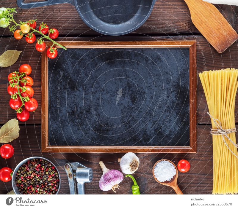ingredients for cooking pasta Vegetable Dough Baked goods Herbs and spices Pan Spoon Wood Line Eating Fresh Large Long Above Brown Yellow Red Black Colour