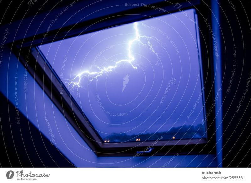 Flash in window Environment Nature Sky Storm clouds Climate Weather Bad weather Gale Thunder and lightning Lightning Threat Rebellious Town Blue Violet Fear