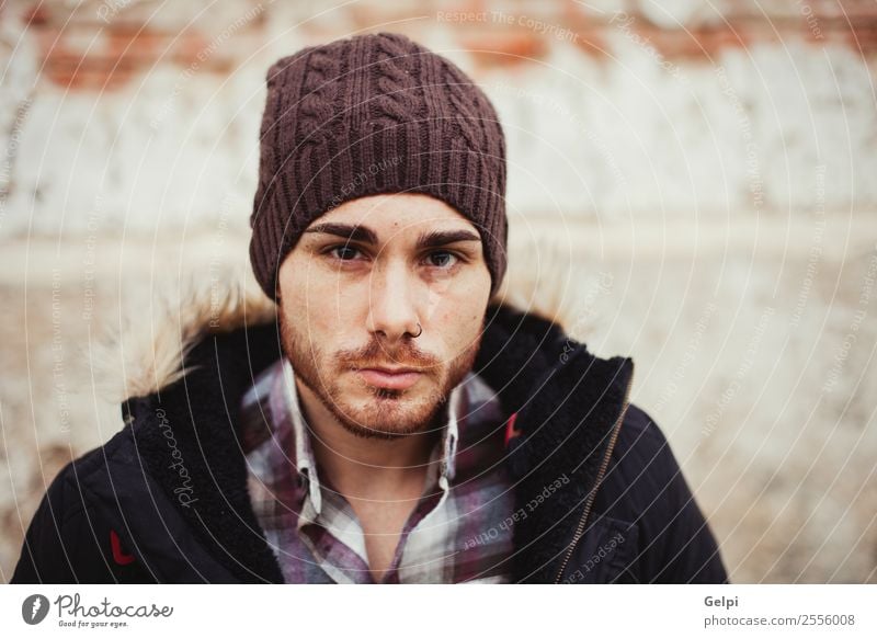 Portrait of attractive guy with wool hat in a old house Lifestyle Style House (Residential Structure) Human being Boy (child) Man Adults Warmth Fashion Piercing