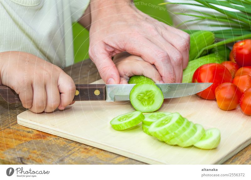 Mother teaches daughter knife cut cucumber Vegetable Eating Dinner Vegetarian diet Diet Lifestyle Summer Table Kitchen Child Human being Adults Nature Steel