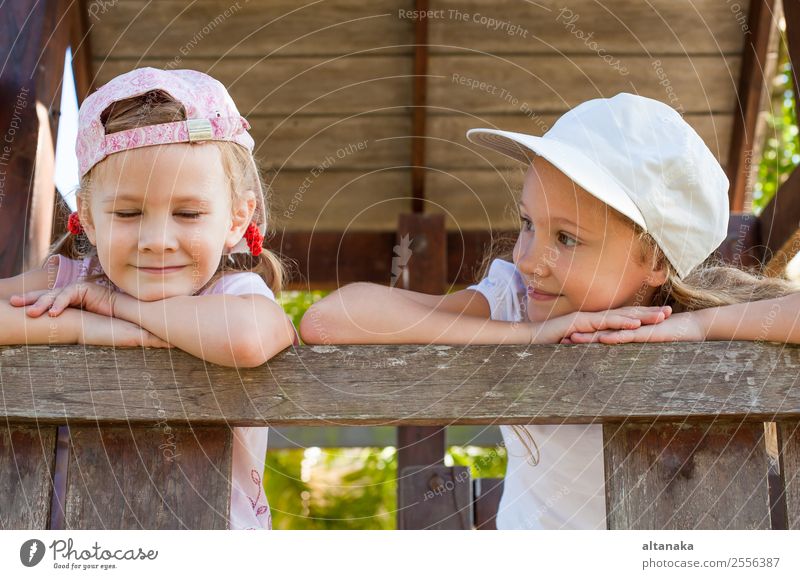 two happy girls standing on the playground Lifestyle Joy Happy Face Relaxation Leisure and hobbies Playing Summer Sports Child Human being Woman Adults