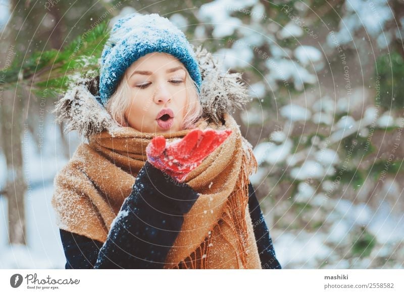 winter portrait of happy young woman Joy Happy Knit Vacation & Travel Adventure Freedom Winter Snow Woman Adults Nature Snowfall Warmth Tree Park Forest Fashion