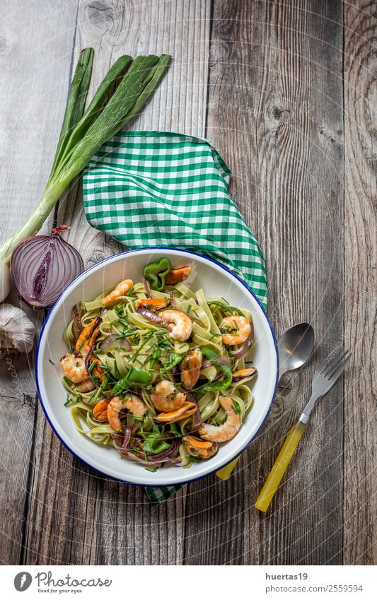 Green tagliatelle with seafood Food Seafood Vegetable Bread Italian Food Plate Fork Table Gastronomy Mussel Delicious Sour Emotions Tagliatelle pasta prawns