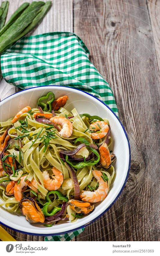 Green tagliatelle with seafood Food Seafood Vegetable Bread Italian Food Plate Fork Table Gastronomy Mussel Delicious Sour Tagliatelle pasta prawns stew