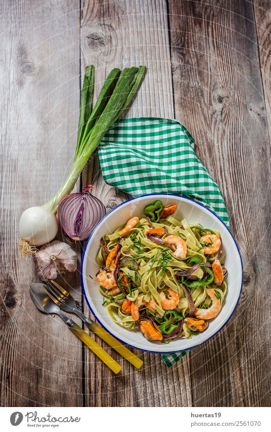 Green tagliatelle with seafood Food Seafood Vegetable Bread Italian Food Plate Fork Table Gastronomy Mussel Delicious Above Sour Tagliatelle pasta prawns stew