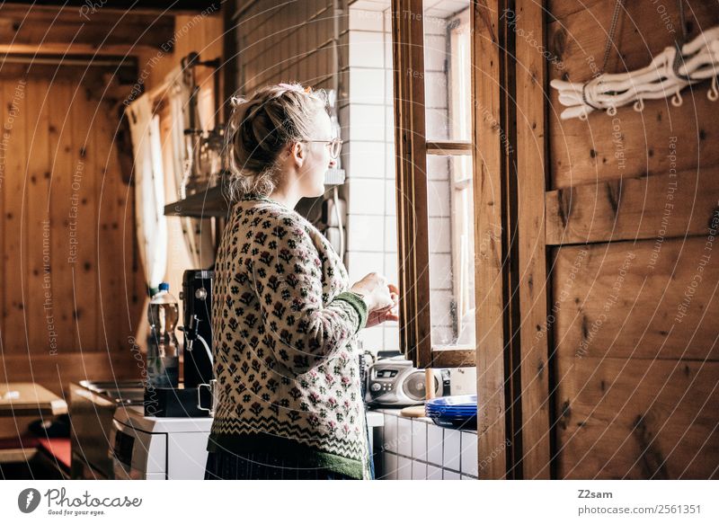Young woman in alpine hut Hut Costume knitted waistcoat Eyeglasses Blonde Think Relaxation Looking Happy Natural Retro Beautiful Contentment Serene Calm Longing