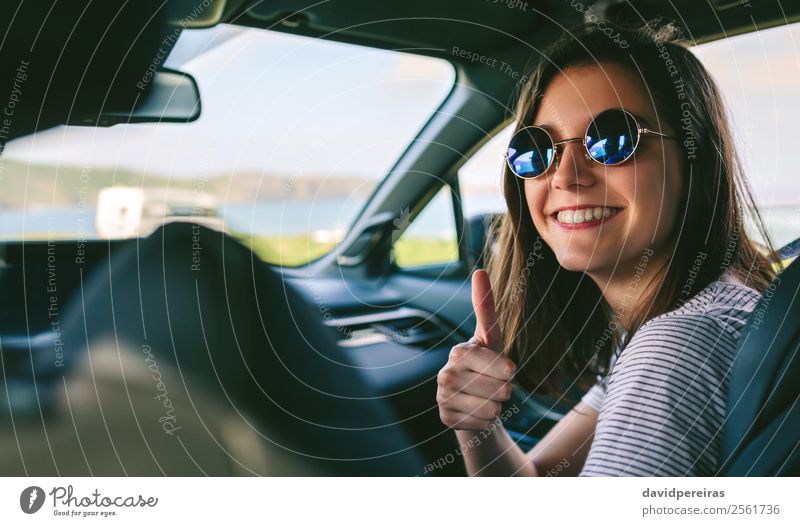 Girl doing thumbs up in the car Lifestyle Joy Happy Beautiful Leisure and hobbies Vacation & Travel Trip Human being Woman Adults Coast Transport Vehicle Car
