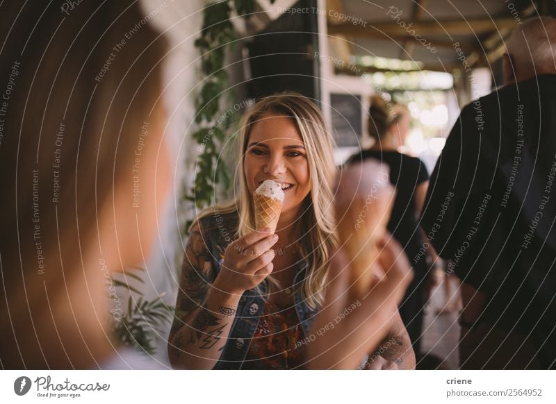 tattooed female eating ice cream with best friend Dessert Ice cream Eating Lifestyle Shopping Joy Happy Beautiful Summer To talk Human being Woman Adults