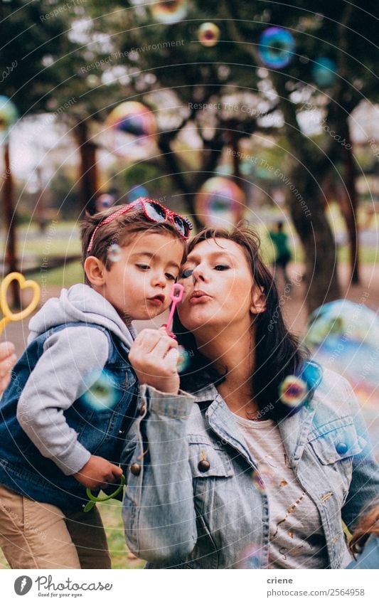 mother and son playing with soap bubbles in park Lifestyle Joy Happy Beautiful Playing Vacation & Travel Summer Child Human being Baby Boy (child) Woman Adults