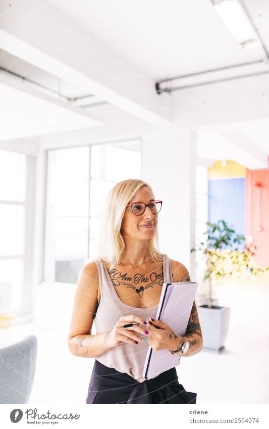 tattooed young businesswoman doing organization at work Lifestyle Style Design Beautiful Work and employment Office Business Company Technology Human being