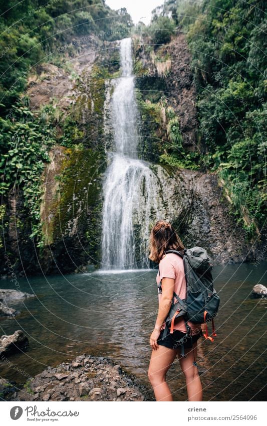 young woman standing in front of tropical waterfall Beautiful Vacation & Travel Tourism Adventure Summer Island Hiking Sports Human being Woman Adults Nature