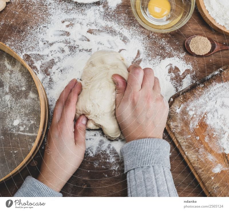 hand kneaded dough Dough Baked goods Bread Table Kitchen Woman Adults Hand Wood Make White Bakery Flour Pizza cooking kneading food Top prepare recipe