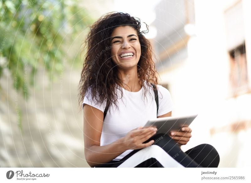 Smiling African woman using digital tablet outdoors. Lifestyle Style Happy Beautiful Hair and hairstyles Tourism Technology Internet Human being Feminine