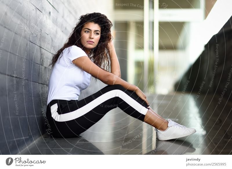 African woman with black curly hairstyle sitting Lifestyle Style Beautiful Hair and hairstyles Face Sports Human being Feminine Young woman Youth (Young adults)