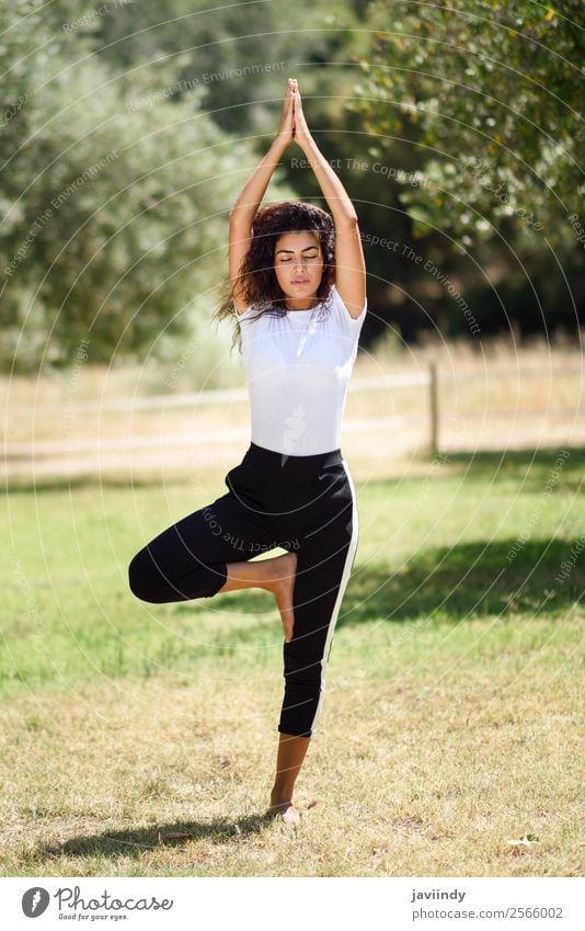 Young Arab woman doing yoga in nature. Lifestyle Beautiful Body Relaxation Calm Meditation Summer Sports Yoga Human being Feminine Young woman