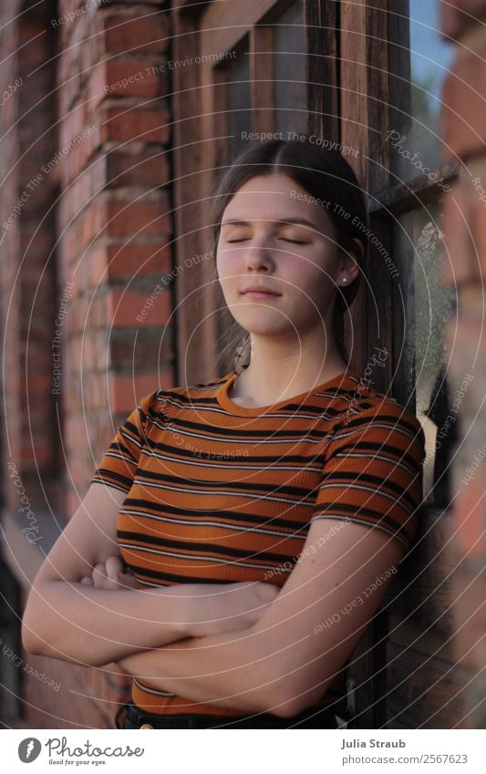 Young woman leaning calmly against brick wall with closed eyes Feminine Youth (Young adults) 1 Human being 13 - 18 years House (Residential Structure)