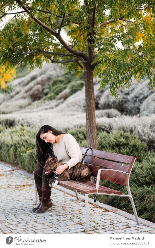 woman sitting with her dog on a bench Lifestyle Beautiful Woman Adults Friendship Animal Tree Park Pet Dog Sit Cute Relationship Relaxation Freedom