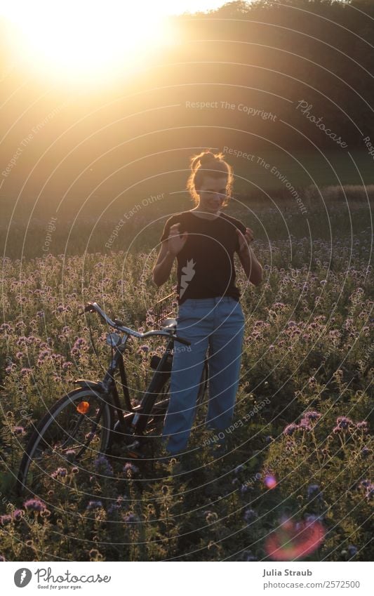 to tell stand woman bicycle Cycling Bicycle Feminine Woman Adults 1 Human being 30 - 45 years Nature Sunrise Sunset Sunlight Summer Beautiful weather Flower