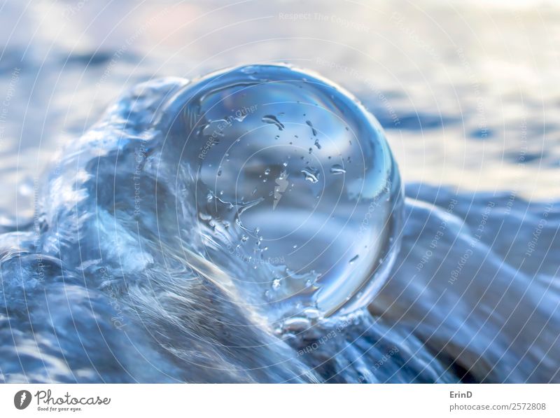 Ocean Water Strikes and Wraps Around Glass Ball Beach Wallpaper Environment Landscape Sand Coast Sphere Movement Uniqueness White Peace wave water Splash drip
