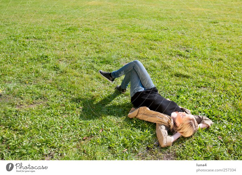relaxed young woman lying on a meadow Relaxation Human being Feminine Young woman Youth (Young adults) 1 18 - 30 years Adults Meadow Blonde Sleep Dream Wait