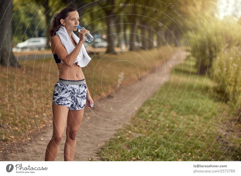 Young sporty woman drinking water from bottle. Bottle Sports Woman Adults 1 Human being 18 - 30 years Youth (Young adults) Park Fitness Athletic Water workout
