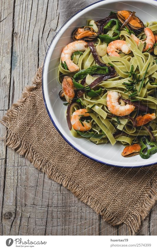 Green tagliatelle with seafood. Food Seafood Vegetable Bread Herbs and spices Italian Food Plate Fork Healthy Eating Table Gastronomy Mussel Delicious