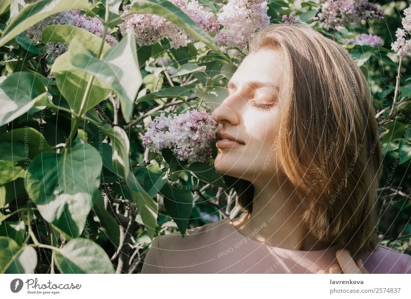 Lifestyle portrait of young white woman in lilac flowers Aromatic Attractive Beautiful Beauty Photography Bushes Cute Face Fashion Woman Flower Young woman