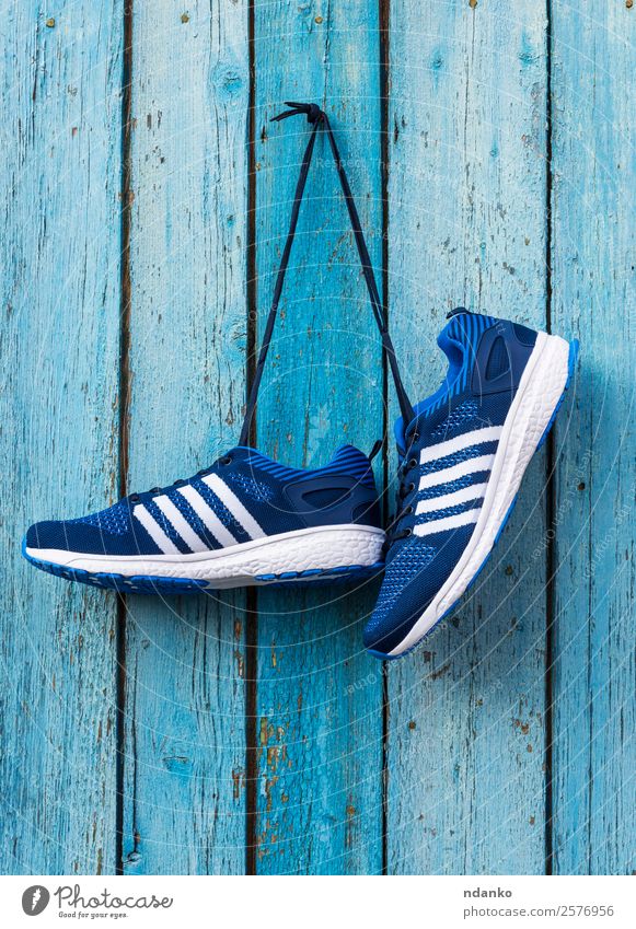 male blue textile sneakers Lifestyle Sports Fashion Clothing Footwear Sneakers Wood Old Fitness Hang Blue background pair nail Gymnasium running wall Hanging