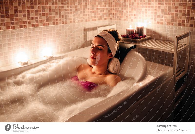 Woman lying in tub doing hydrotherapy treatment Beautiful Body Health care Medical treatment Wellness Relaxation Spa Leisure and hobbies Bathtub Human being