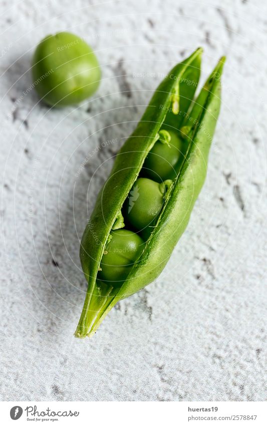 Close up peas on colorful table Food Vegetable Nutrition Vegetarian diet Diet Healthy Eating Table Collection Wood Fresh Natural Above Green Colour Peas Detox