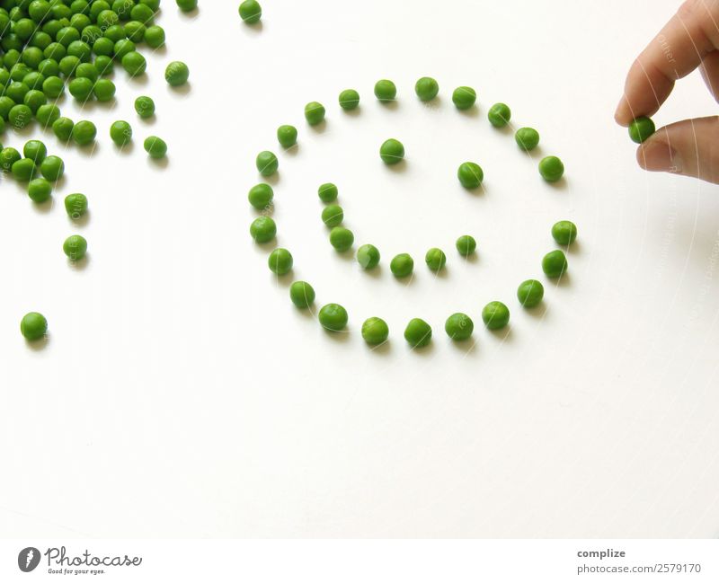 Happy peas Food Vegetable Lettuce Salad Nutrition Eating Vegetarian diet Diet Fasting Face Playing Hand Happiness Healthy Many Green Optimism Sympathy