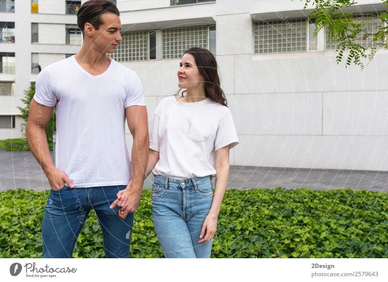 Young beautiful couple posing wearing jeans and t-shirt Lifestyle Style Happy Beautiful Woman Adults Man Friendship Couple 2 Human being 18 - 30 years