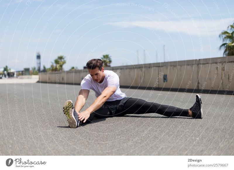 Muscular man stretching outdoors Lifestyle Body Healthy Health care Relaxation Summer Sports Fitness Sports Training Track and Field Human being Masculine