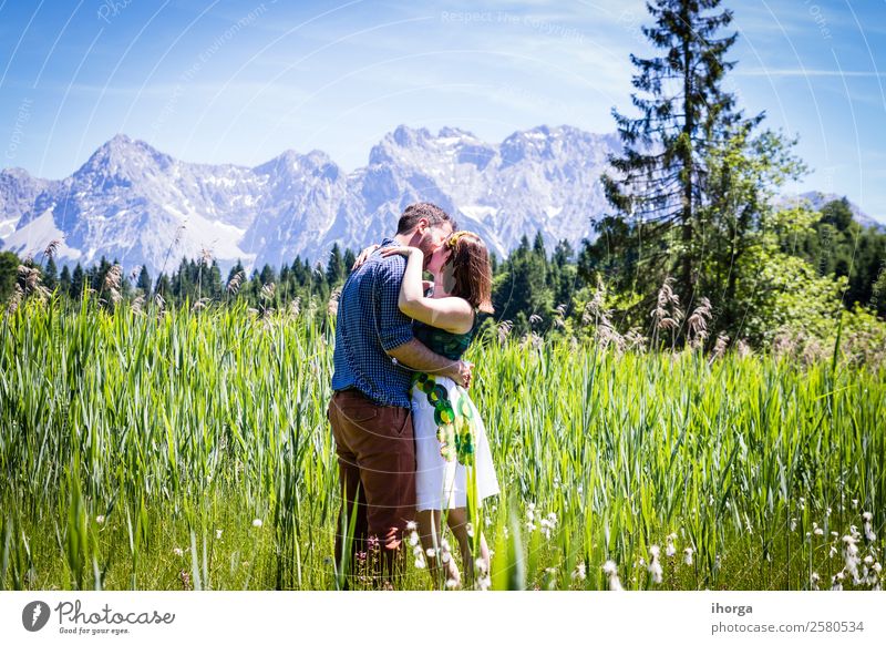 Two happy lovers on Holiday in the alps mountains Lifestyle Happy Beautiful Relaxation Vacation & Travel Adventure Summer Mountain Woman Adults Man Couple