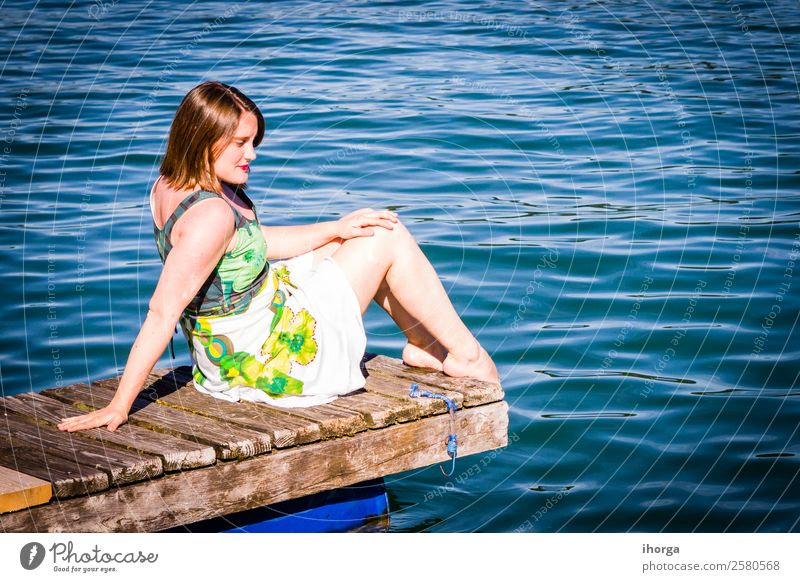 Woman on vacation at the pier on a lake Lifestyle Happy Beautiful Relaxation Vacation & Travel Adventure Summer Mountain Adults 1 Human being 30 - 45 years