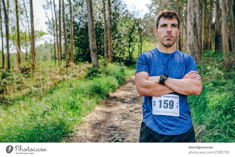 Male trail athlete posing with race number Lifestyle Sports Human being Man Adults Nature Tree Forest Lanes & trails Authentic Self-confident Pride Competition